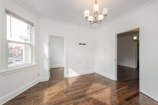 unfurnished room featuring crown molding, dark wood-type flooring, and a chandelier