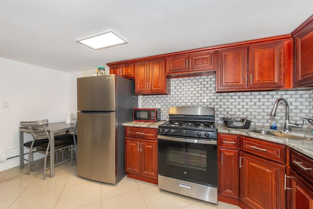 kitchen with sink, light tile patterned floors, stainless steel appliances, tasteful backsplash, and light stone counters