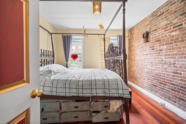 352 7th St Unit 3, Jersey City, NJ 07302 - bedroom featuring brick wall and wood finished floors
