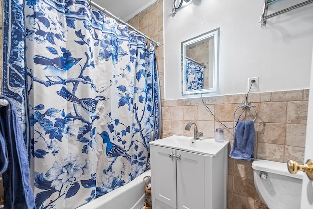 352 7th St Unit 3, Jersey City, NJ 07302 - full bath with tile walls, vanity, shower / bath combo with shower curtain, and a wainscoted wall