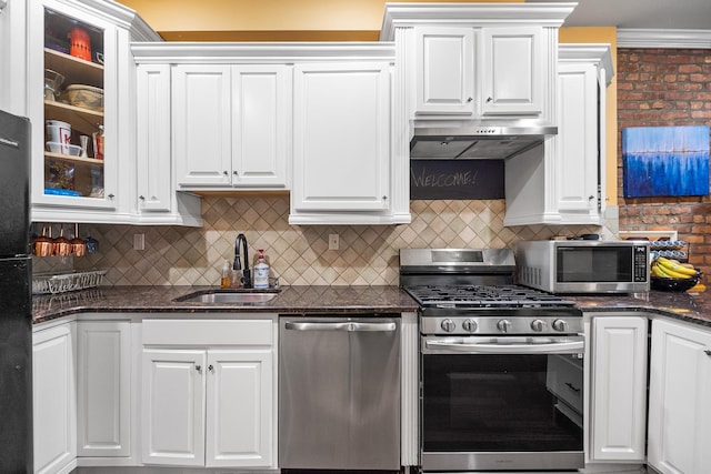 352 7th St Unit 3, Jersey City, NJ 07302 - kitchen featuring stainless steel appliances, under cabinet range hood, white cabinets, and glass insert cabinets