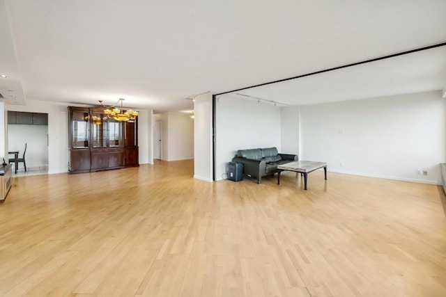 300 Winston Dr # 1822, Cliffside Park, NJ 07010 - living room featuring light wood-type flooring and a chandelier