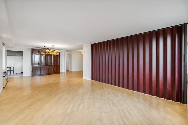 300 Winston Dr # 1822, Cliffside Park, NJ 07010 - unfurnished living room with a chandelier and light wood-style flooring