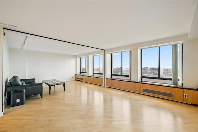 300 Winston Dr # 1822, Cliffside Park, NJ 07010 - spare room featuring light wood-style floors and rail lighting