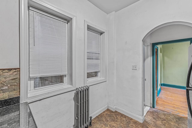 300 2nd St Unit 2, Jersey City, NJ 07302 - hallway featuring radiator heating unit and baseboards