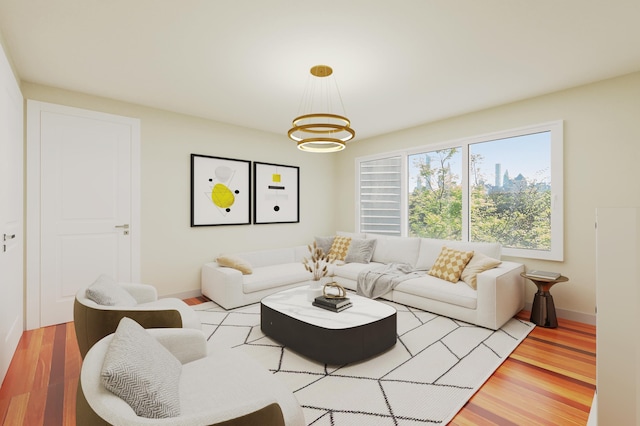 living area with a chandelier, wood finished floors, and baseboards