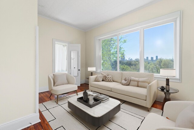living room with light wood finished floors and baseboards