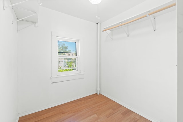 walk in closet featuring light wood-style floors