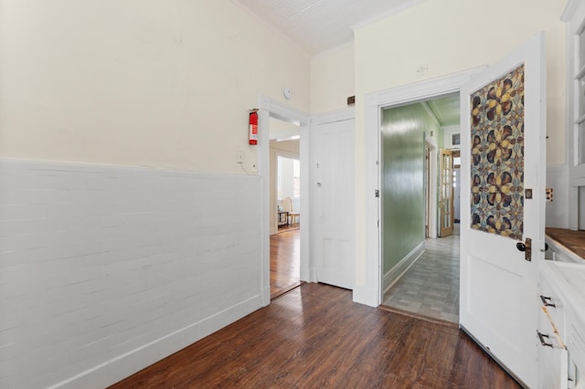 unfurnished room with dark wood-style flooring