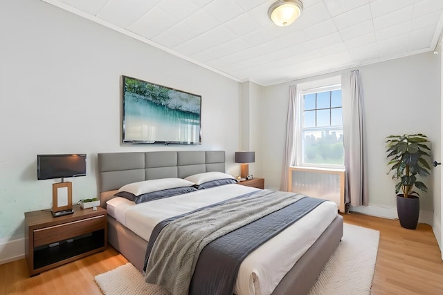 572 Gregory Ave, Weehawken, NJ 07086 - bedroom featuring ornamental molding and light wood-style flooring