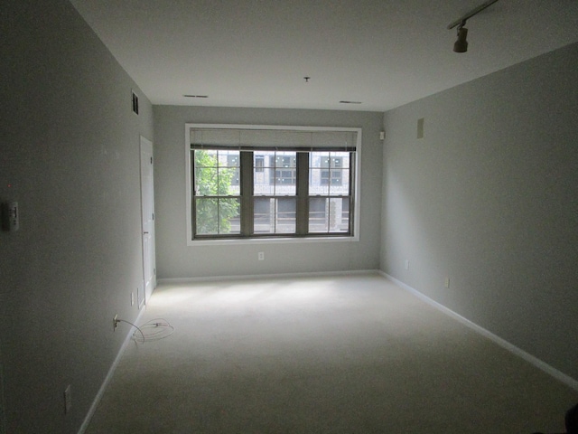 26 Ave At Port Imperial Unit 212, West New York, NJ 07093 - empty room with light carpet and rail lighting