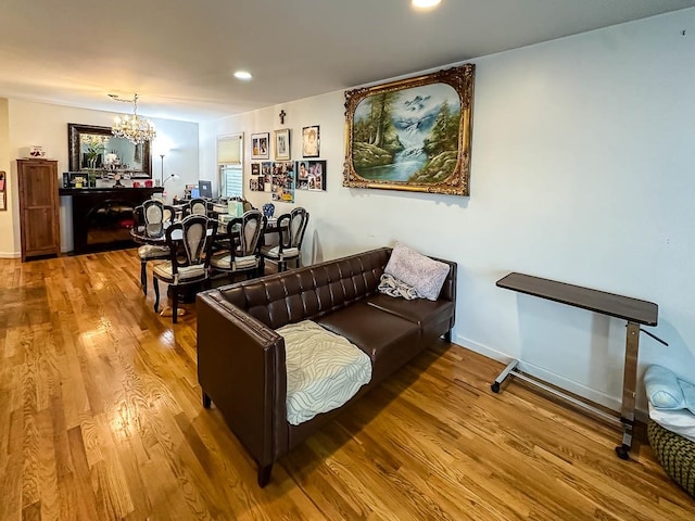 living room with a chandelier and hardwood / wood-style floors