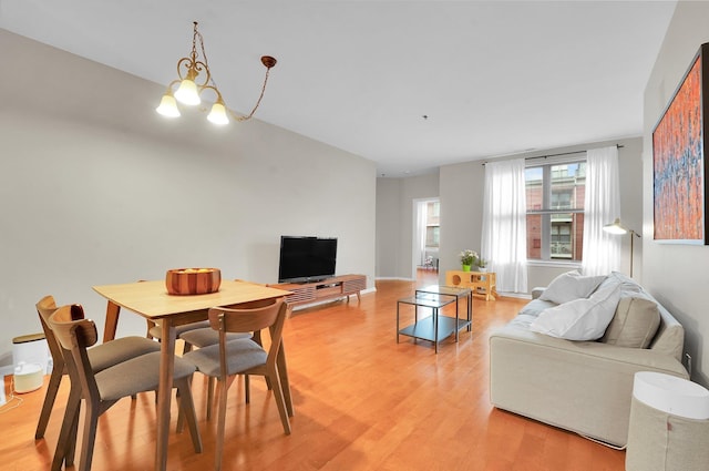 26 Ave At Port Imperial Unit 133, West New York, NJ 07093 - living area with light wood-style flooring and a chandelier
