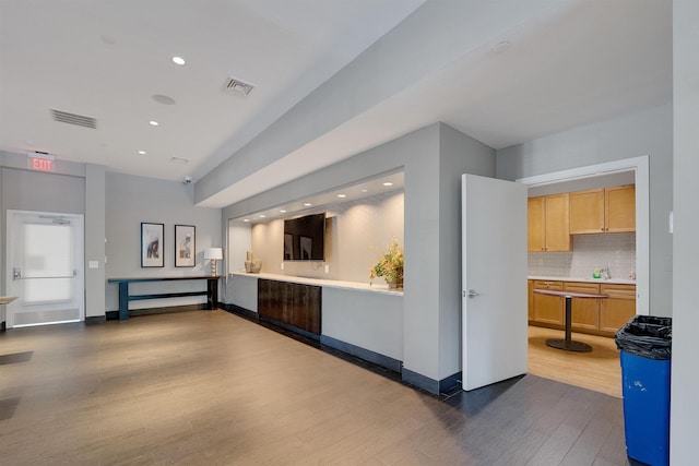 26 Ave At Port Imperial Unit 133, West New York, NJ 07093 - kitchen with dark wood-type flooring, tasteful backsplash, light countertops, recessed lighting, and light brown cabinets