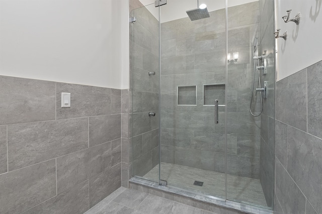 bathroom with a shower with shower door