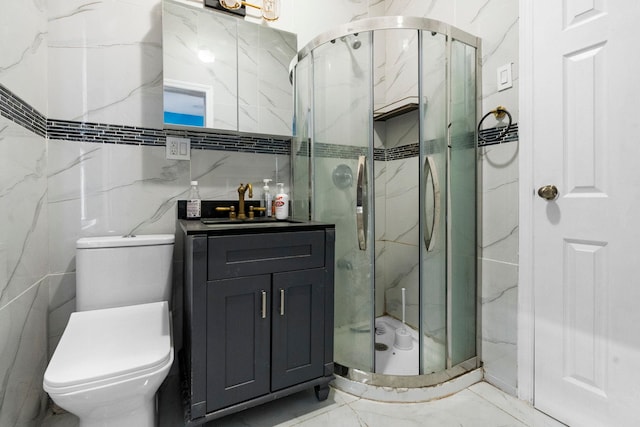 15 9th St, Bayonne, NJ 07002 - full bathroom featuring tile walls, a marble finish shower, vanity, toilet, and marble finish flooring