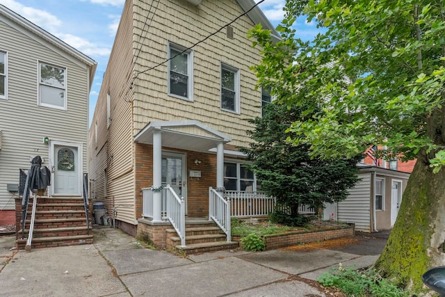 15 9th St, Bayonne, NJ 07002 - view of front of home with entry steps and a porch