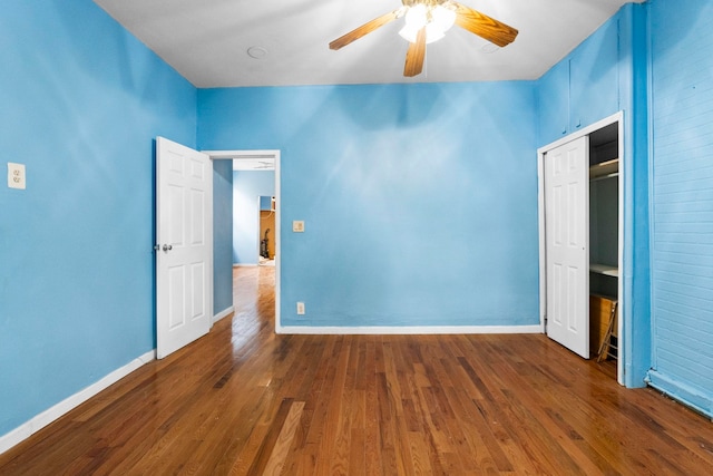 15 9th St, Bayonne, NJ 07002 - unfurnished bedroom featuring wood finished floors, baseboards, and a ceiling fan