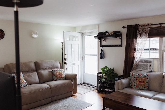 living room featuring light wood-type flooring and cooling unit