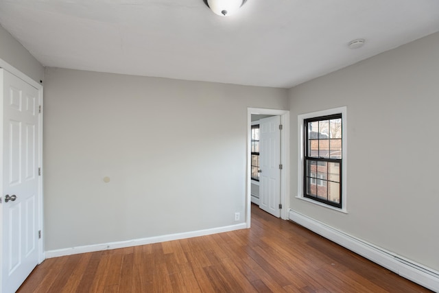 23 Westervelt Pl, Jersey City, NJ 07304 - spare room with wood-type flooring, a baseboard radiator, and baseboards
