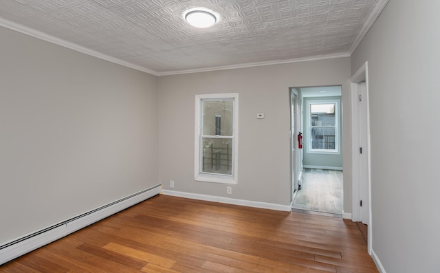 23 Westervelt Pl, Jersey City, NJ 07304 - empty room with an ornate ceiling, baseboards, light wood finished floors, and baseboard heating