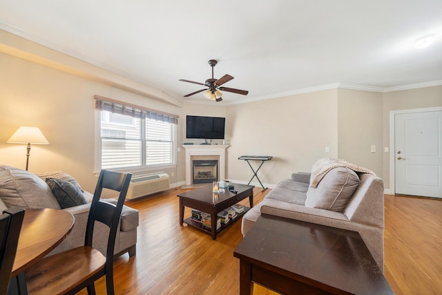 301 68th St Unit 8, Guttenberg, NJ 07093 - living room with a ceiling fan, light wood-type flooring, crown molding, a fireplace, and a wall mounted AC