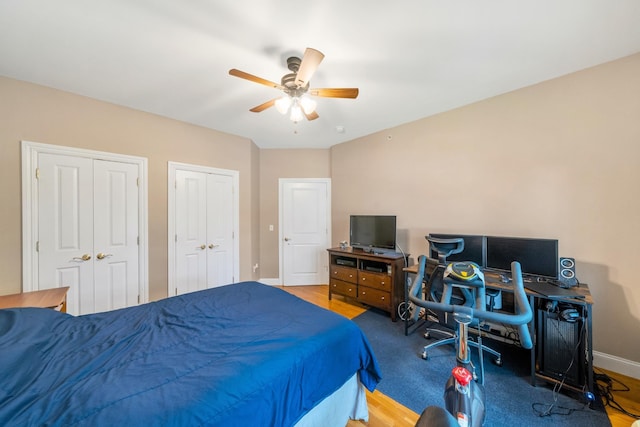 301 68th St Unit 8, Guttenberg, NJ 07093 - bedroom featuring multiple closets, ceiling fan, and wood finished floors