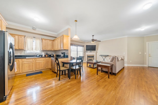 301 68th St Unit 8, Guttenberg, NJ 07093 - kitchen featuring light brown cabinets, stainless steel appliances, a ceiling fan, dark countertops, and ornamental molding