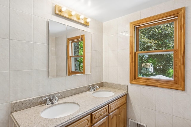 16 Hazel Ave, Livingston, NJ 07039 - full bathroom with tile walls and double vanity