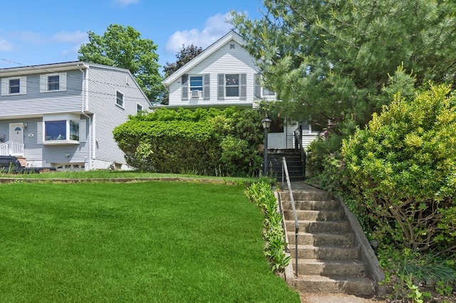 16 Hazel Ave, Livingston, NJ 07039 - view of front of property with stairway, a front yard, and cooling unit