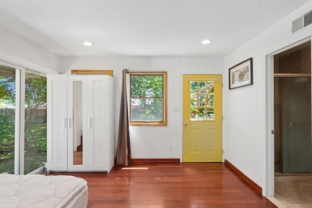 16 Hazel Ave, Livingston, NJ 07039 - foyer with healthy amount of natural light, dark wood finished floors, baseboards, and recessed lighting