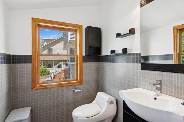 16 Hazel Ave, Livingston, NJ 07039 - bathroom with tile walls, toilet, vanity, and wainscoting