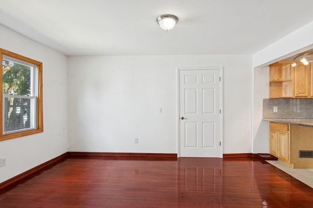 16 Hazel Ave, Livingston, NJ 07039 - unfurnished dining area featuring dark wood-style flooring and baseboards