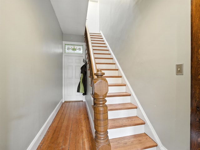 75 Reservoir Ave, Jersey City, NJ 07307 - staircase with hardwood / wood-style flooring and baseboards