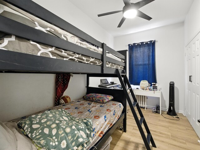 75 Reservoir Ave, Jersey City, NJ 07307 - bedroom featuring wood finished floors, ceiling fan, and radiator