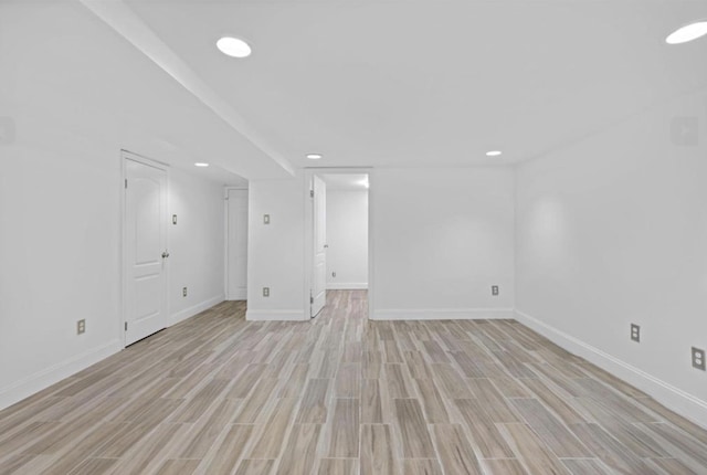 75 Reservoir Ave, Jersey City, NJ 07307 - unfurnished living room with light wood finished floors and recessed lighting