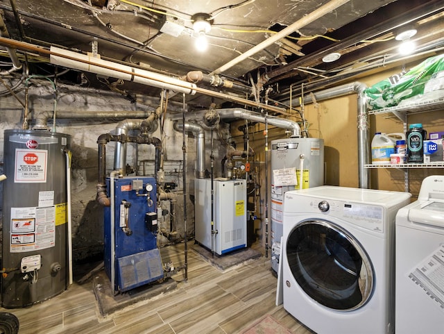 75 Reservoir Ave, Jersey City, NJ 07307 - washroom with water heater, washing machine and clothes dryer, a heating unit, and wood tiled floors