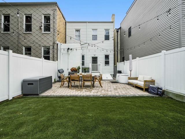 75 Reservoir Ave, Jersey City, NJ 07307 - back of property featuring a patio area and a fenced backyard