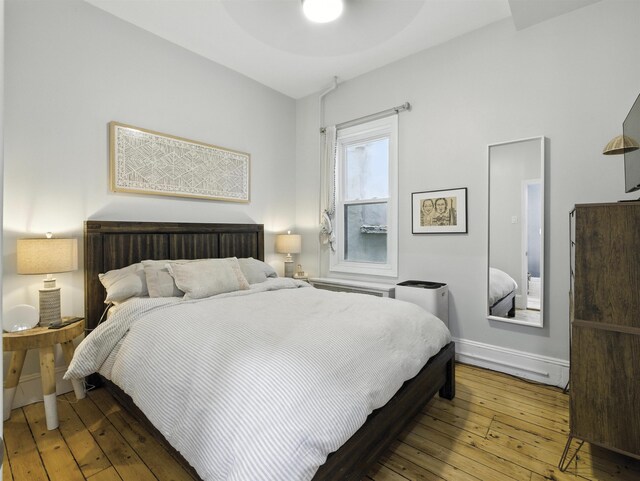 75 Reservoir Ave, Jersey City, NJ 07307 - bedroom with wood-type flooring and baseboards