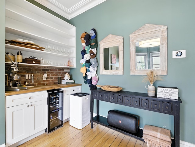 75 Reservoir Ave, Jersey City, NJ 07307 - indoor bar with beverage cooler, ornamental molding, and light wood finished floors