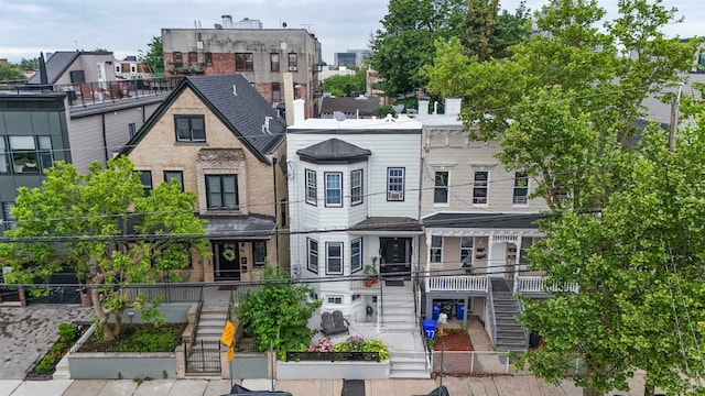 75 Reservoir Ave, Jersey City, NJ 07307 - view of front of property with stairs, a fenced front yard, and a gate