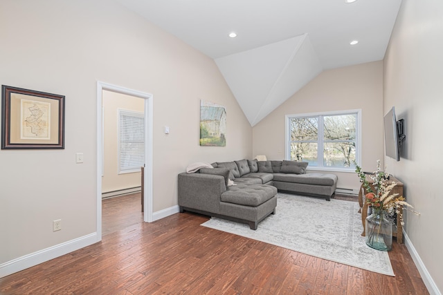 living room featuring dark wood-type flooring, vaulted ceiling, and a baseboard heating unit