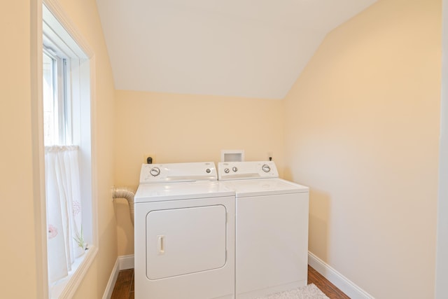 clothes washing area featuring hardwood / wood-style floors and separate washer and dryer