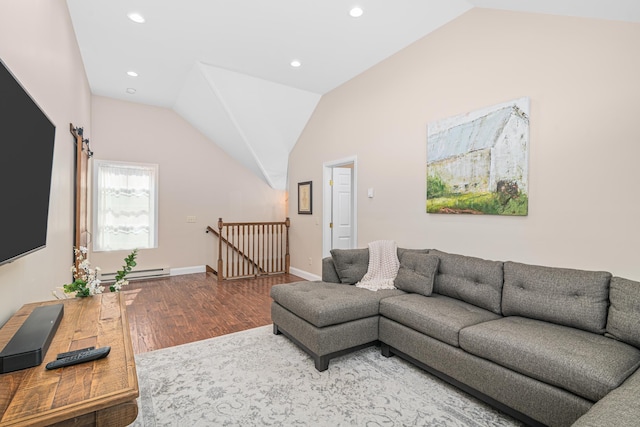 living room featuring wood-type flooring, baseboard heating, and vaulted ceiling