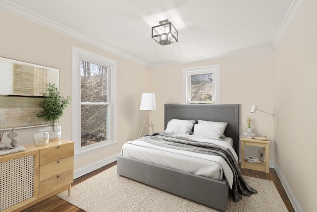 bedroom featuring crown molding and dark wood-type flooring