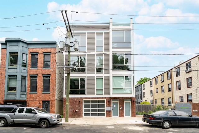 414 1st St Unit 5, Jersey City, NJ 07302 - view of building exterior featuring an attached garage