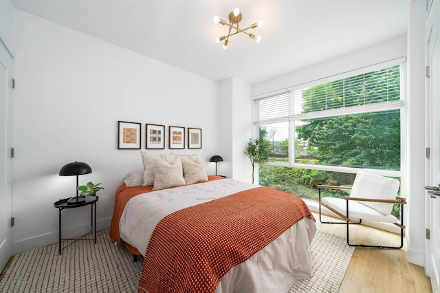 414 1st St Unit 5, Jersey City, NJ 07302 - bedroom with a chandelier and baseboards