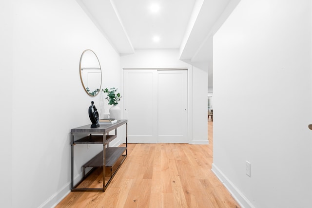 corridor with light wood-type flooring