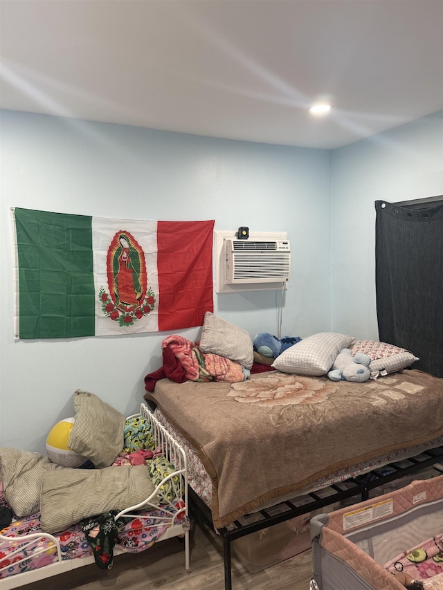 4312 Cottage St, North Bergen, NJ 07047 - bedroom featuring wood finished floors and an AC wall unit