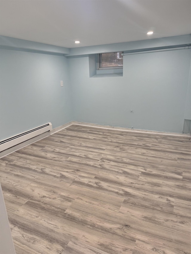 4312 Cottage St, North Bergen, NJ 07047 - finished below grade area featuring wood finished floors, recessed lighting, and baseboard heating